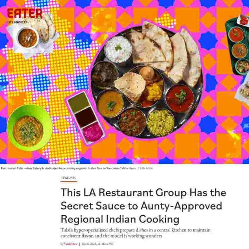 A large thali platter with various Indian dishes, rice, and naan bread on a colorful background.